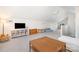 Open bonus room features large tv, hardwood floors and multiple seating areas at 10 North Rd, Salisbury, NC 28144