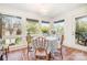 Sunlit breakfast nook featuring a dining table, terracotta tiled floors, and large windows with yard views at 10 North Rd, Salisbury, NC 28144