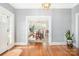 Elegant dining room view showcasing the transition between dining and living areas with wallpapered accent wall at 10 North Rd, Salisbury, NC 28144
