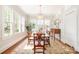 Bright dining room with a chandelier, natural light from large windows, and an oriental rug at 10 North Rd, Salisbury, NC 28144