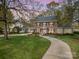 Charming brick two-story home with mature trees, a circular driveway and pristine landscaping at 10 North Rd, Salisbury, NC 28144