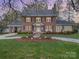 Beautiful brick two-story home with mature trees, a circular driveway and manicured lawn at 10 North Rd, Salisbury, NC 28144