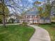Beautiful two-story brick home with a winding driveway and lush green lawn, perfect for curb appeal at 10 North Rd, Salisbury, NC 28144