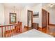 Upstairs hallway with hardwood floors, natural light, wood trim, and access to a bathroom at 10 North Rd, Salisbury, NC 28144