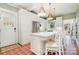 Charming kitchen with white cabinetry, tiled countertops, and breakfast bar seating at 10 North Rd, Salisbury, NC 28144