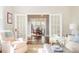Elegant living room showcasing seamless transition to the dining area through stylish glass doors at 10 North Rd, Salisbury, NC 28144