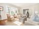 Comfortable living room featuring large windows, neutral decor, and a welcoming seating arrangement at 10 North Rd, Salisbury, NC 28144