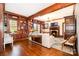Elegant living room with wood paneled bookshelves, fireplace, and hardwood floors at 10 North Rd, Salisbury, NC 28144