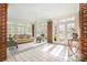 Bright sunroom with tile floor, brick accents, and plenty of windows at 10 North Rd, Salisbury, NC 28144