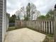Fenced backyard featuring concrete patio, grass, and side of house at 10400 Brawley Ln # 8, Charlotte, NC 28215