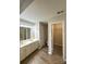Spacious bathroom with dual vanities, a large mirror, and separate toilet and closet areas for added convenience at 10400 Brawley Ln # 8, Charlotte, NC 28215