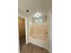 Bathroom featuring a bathtub-shower combination, a small window, and easy access to the walk-in closet at 10400 Brawley Ln # 8, Charlotte, NC 28215