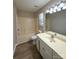Full bathroom with wood flooring, window, bathtub, toilet, and vanity at 10400 Brawley Ln # 8, Charlotte, NC 28215