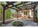 Wooden pergola with brick patio in the backyard at 125 Cove Creek Loop # 18, Mooresville, NC 28117