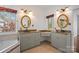 Primary bathroom featuring soaking tub, two sinks, mirrors and tile floors at 125 Cove Creek Loop # 18, Mooresville, NC 28117