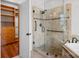 Walk-in shower with tile surround, glass door and built-in seat and shelving at 125 Cove Creek Loop # 18, Mooresville, NC 28117
