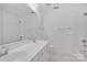 A well-lit bathroom features a double sink vanity, large mirror, and a shower-tub combination at 125 Cove Creek Loop # 18, Mooresville, NC 28117