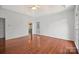 The main bedroom features wood floors, a ceiling fan and two windows at 125 Cove Creek Loop # 18, Mooresville, NC 28117