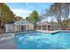 Community pool featuring a pool house, covered picnic area and wrought iron fence at 125 Cove Creek Loop # 18, Mooresville, NC 28117