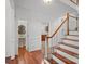 Foyer features hardwood floors, staircase, and a half-bath at 125 Cove Creek Loop # 18, Mooresville, NC 28117