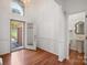 Bright foyer with hardwood floors, a half-bath, and large windows at 125 Cove Creek Loop # 18, Mooresville, NC 28117
