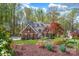 Charming brick home with manicured lawn and lush landscaping at 125 Cove Creek Loop # 18, Mooresville, NC 28117