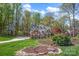 Beautiful brick home with meticulously maintained front yard at 125 Cove Creek Loop # 18, Mooresville, NC 28117
