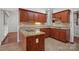 Updated kitchen features granite countertops, stainless steel appliances, and custom cherry wood cabinetry at 125 Cove Creek Loop # 18, Mooresville, NC 28117