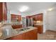Well-appointed kitchen with stainless steel appliances, granite countertops, and custom cabinets at 125 Cove Creek Loop # 18, Mooresville, NC 28117