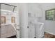 Bright laundry room features a washer, dryer, sink and cabinet for storage at 125 Cove Creek Loop # 18, Mooresville, NC 28117