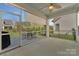 Screened-in porch with ceiling fan overlooks backyard and green space at 13311 Union Square Dr, Huntersville, NC 28078