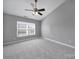 Bedroom featuring neutral carpet, ceiling fan, and natural light at 13376 Calloway Glen Dr, Charlotte, NC 28273
