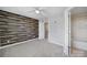 Bedroom featuring a wood accent wall, a ceiling fan, and ensuite bath at 13376 Calloway Glen Dr, Charlotte, NC 28273