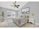 Bedroom featuring a ceiling fan, window, and stylish decor at 13376 Calloway Glen Dr, Charlotte, NC 28273