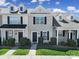 Charming townhome featuring a well-maintained lawn, classic architectural details, and a welcoming entrance at 13376 Calloway Glen Dr, Charlotte, NC 28273