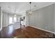 Eat in kitchen with hardwood floors, stainless steel appliances, and an island at 13376 Calloway Glen Dr, Charlotte, NC 28273