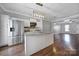 Well-equipped kitchen featuring stainless steel appliances, a center island, and a view to the living room at 13376 Calloway Glen Dr, Charlotte, NC 28273