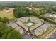 Beautiful aerial view of condos surrounding a community pool with mature trees and parking at 140 Lake Concord Ne Rd # D-1, Concord, NC 28025