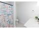 Bathroom with white vanity, colorful shower curtain, tile floor, and a modern black faucet at 1643 Mayfair Dr, Conover, NC 28613