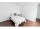 Neutral bedroom design with hardwood floors, natural light, minimal furniture, and comfortable bed at 1643 Mayfair Dr, Conover, NC 28613
