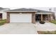 Well-maintained brick home with an attached garage and driveway, front yard landscaped with white gravel at 1643 Mayfair Dr, Conover, NC 28613