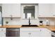 Bright kitchen with stainless steel appliances, wooden countertops and modern black fixtures at 1643 Mayfair Dr, Conover, NC 28613