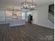 Bright and airy open concept living space with a contemporary kitchen and stylish light fixtures at 1939 Hendricks St, Rock Hill, SC 29732