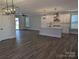 Inviting living space with a modern kitchen featuring an island, stainless steel appliances and open floor plan at 1939 Hendricks St, Rock Hill, SC 29732
