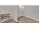Bright bathroom with wood floors, a vanity, and a decorative seat at 1975 Old Wilkesboro Rd, Taylorsville, NC 28681