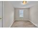 Neutral bedroom featuring wood floors, a window that provides natural light, and base molding at 1975 Old Wilkesboro Rd, Taylorsville, NC 28681