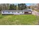 Charming home with well-maintained lawn, carport, and a welcoming entrance, perfect for Gathering living at 1975 Old Wilkesboro Rd, Taylorsville, NC 28681