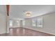 Bright living room with hardwood floors, neutral walls, a decorative lighting fixture and large windows at 1975 Old Wilkesboro Rd, Taylorsville, NC 28681