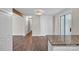 Open-concept living space with wood floors, modern lighting, and sliding glass doors at 1975 Old Wilkesboro Rd, Taylorsville, NC 28681