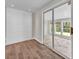 Room featuring wood trim, a sliding glass door and hardwood floors at 1975 Old Wilkesboro Rd, Taylorsville, NC 28681